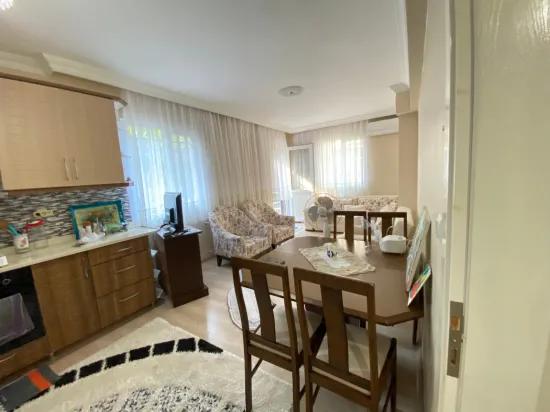 In Ürkmez Center ground floor 2+1 full furnished apartment