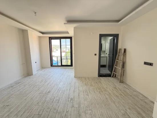 В Сеферихисаре Doğanbey Продается 1+1 Квартира На Стороне Моря Продается Квартира