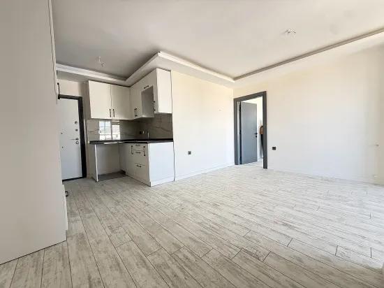 В Сеферихисаре Doğanbey Продается 1+1 Квартира На Стороне Моря Продается Квартира
