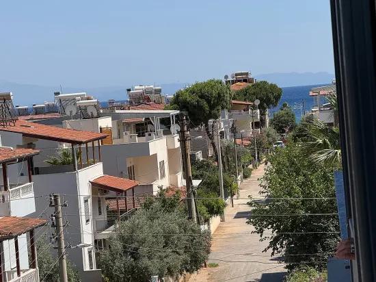 В Сеферихисаре Doğanbey Продается 1+1 Квартира На Стороне Моря Продается Квартира