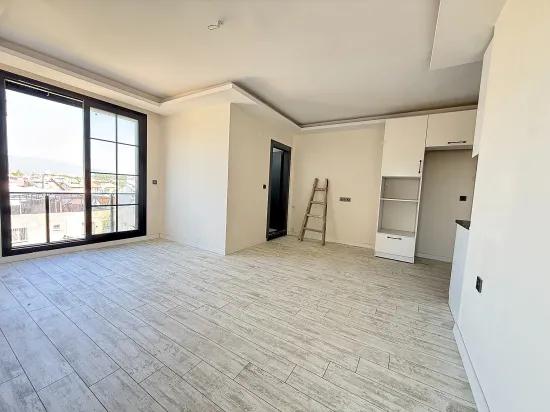 В Сеферихисаре Doğanbey Продается 1+1 Квартира На Стороне Моря Продается Квартира